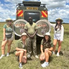 Smiling Pride of Africa guests with their safari guide