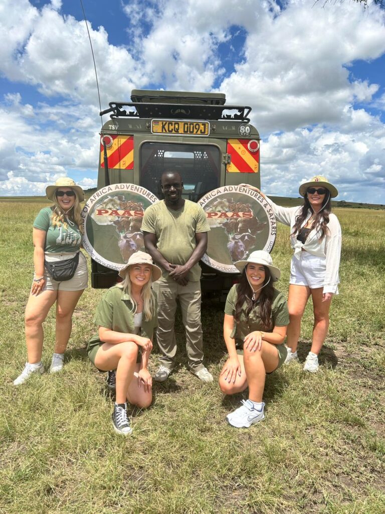 Safari guide with guests in the Maasai Mara
